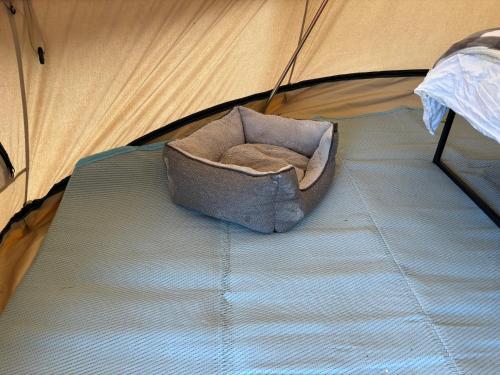 cozy hot tent with log burner and hot tub right tent