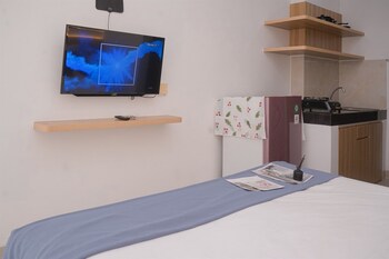 simply and homey studio room serpong garden apartment