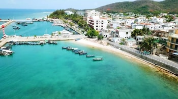 sanya qixili hotel free two wheeled electric bike ride around the island