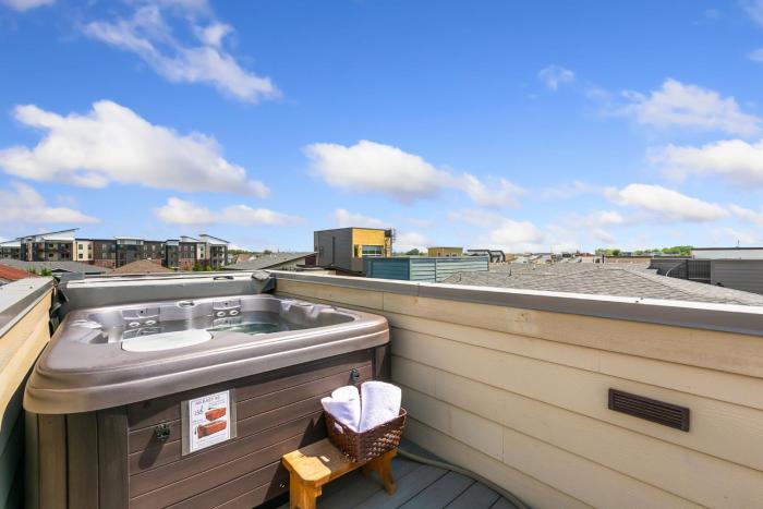the cycle haus rooftop deck with hot tub and views