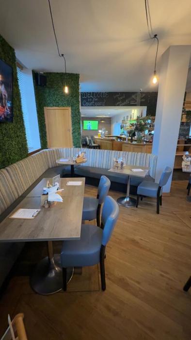 the courtyard bar kitchen and rooms