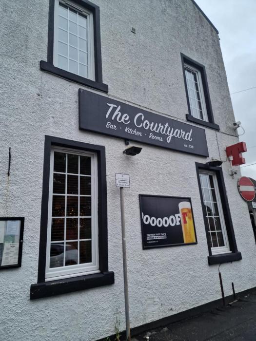 the courtyard bar kitchen and rooms