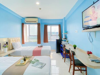 simple blue toned studio no kitchen at elvis tower apartment