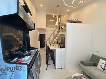 cozy loft condo in tanza with arcade