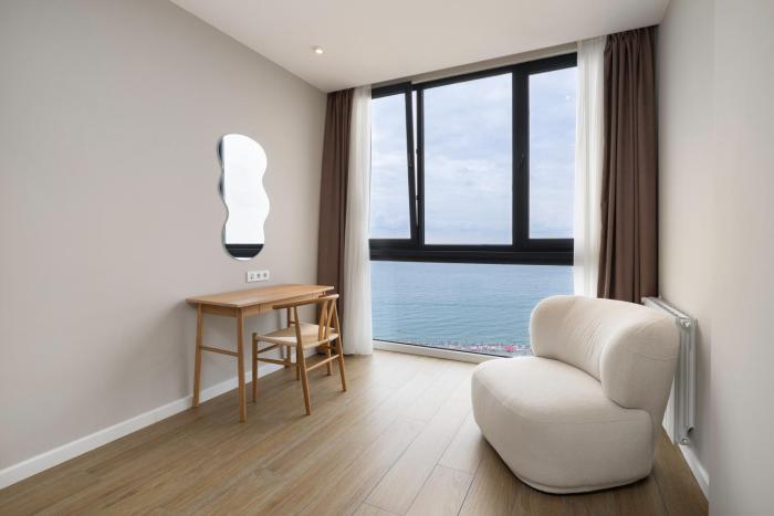 next white aparthotel official