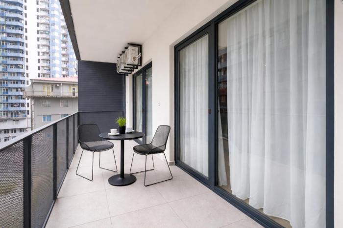 next white aparthotel official