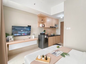 soft ivory studio at royal sentul park apartment