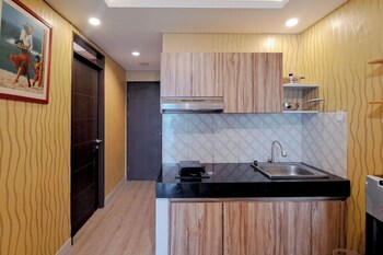 wooden accent 2br at mekarwangi square cibaduyut apartment
