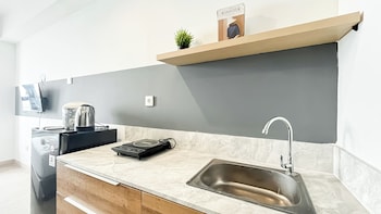 modern look studio room at collins boulevard apartment
