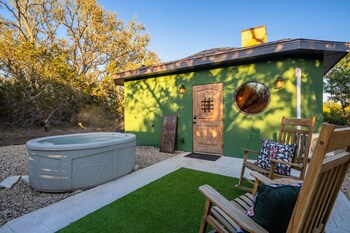 woodsman hobbit with hot tub and fireplace