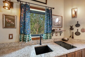 woodsman hobbit with hot tub and fireplace
