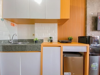 orange style studio at transpark cibubur apartment