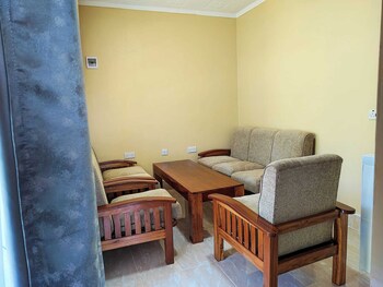 calm breeze resort rwanchege