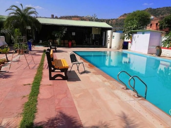 palm farmhouse resort and swimming pool