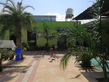 palm farmhouse resort and swimming pool