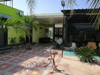 palm farmhouse resort and swimming pool