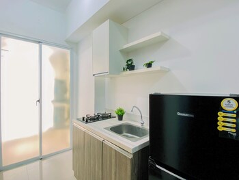 compact white 2br near rawa buaya station at vittoria residence