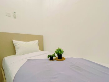 compact white 2br near rawa buaya station at vittoria residence