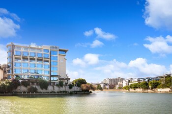 global village riverside hotel