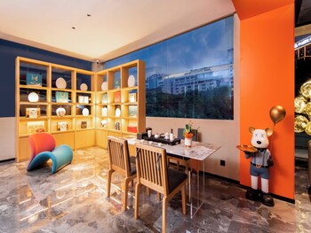 global village riverside hotel
