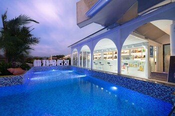 global village riverside hotel