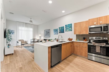 riviere apartments king bed suite and pool and gym and pet friendly and near epic universe