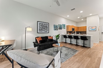riviere apartments king bed suite and pool and gym and pet friendly and near epic universe