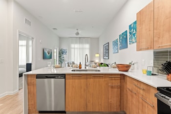 riviere apartments king bed suite and pool and gym and pet friendly and near epic universe