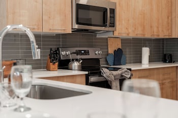 riviere apartments king bed suite and pool and gym and pet friendly and near epic universe