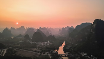 cindy villa rice fields and karst peaks at yulong river infinity pool
