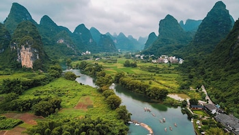 cindy villa rice fields and karst peaks at yulong river infinity pool