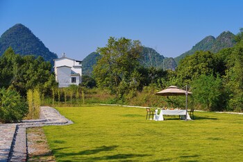 cindy villa rice fields and karst peaks at yulong river infinity pool