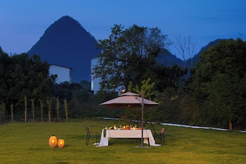 cindy villa rice fields and karst peaks at yulong river infinity pool