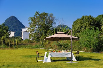 cindy villa rice fields and karst peaks at yulong river infinity pool