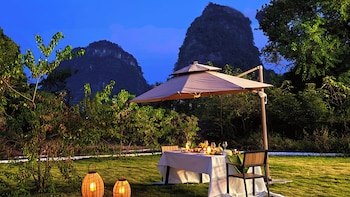 cindy villa rice fields and karst peaks at yulong river infinity pool