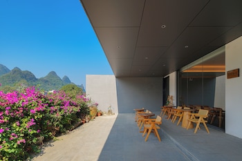 cindy villa rice fields and karst peaks at yulong river infinity pool