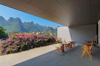 cindy villa rice fields and karst peaks at yulong river infinity pool
