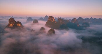 cindy villa rice fields and karst peaks at yulong river infinity pool