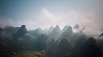 cindy villa rice fields and karst peaks at yulong river infinity pool