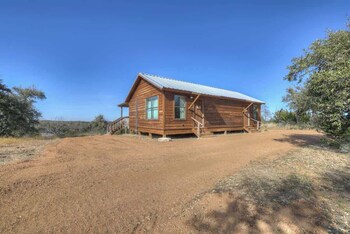 mesquite cabin with hot tub and hill country views