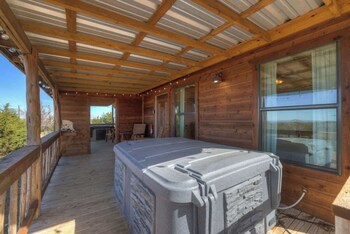 mesquite cabin with hot tub and hill country views