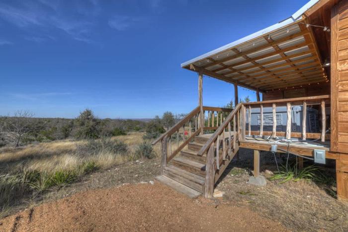 mesquite cabin with hot tub and hill country views