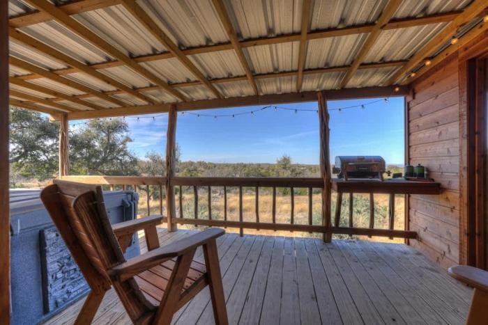 mesquite cabin with hot tub and hill country views