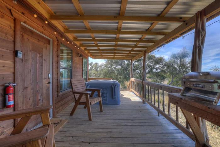 mesquite cabin with hot tub and hill country views