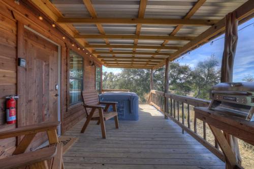 mesquite cabin with hot tub and hill country views