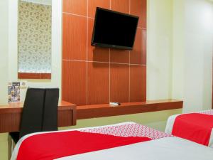 raising hotel makassar