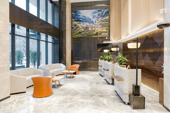 atour hotel international trade city yiwu