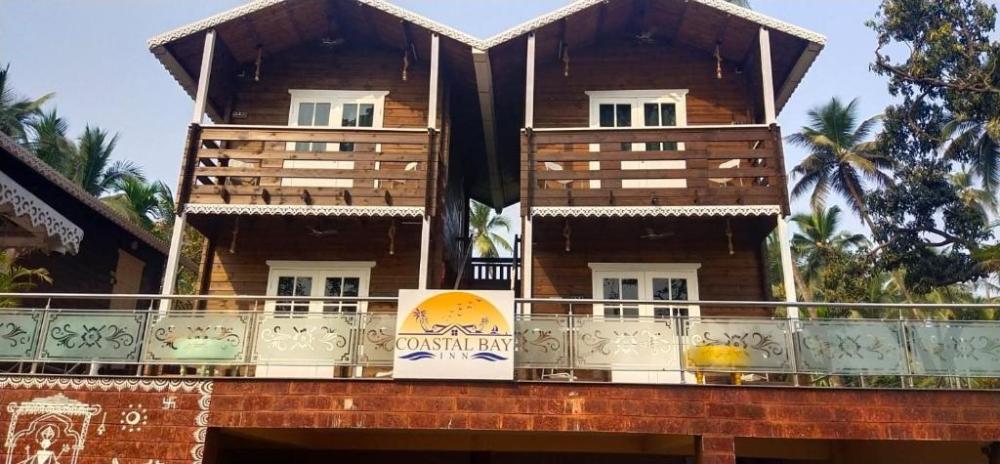 coastal bay inn by green apple stays