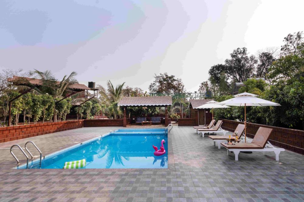 crimson bricks and woods resort cottages karjat