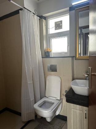 luxurious 1bhk apartment in gurgaon with shared pool and bbq area